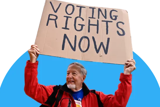 Man holding a sign that reads "voting rights now" 