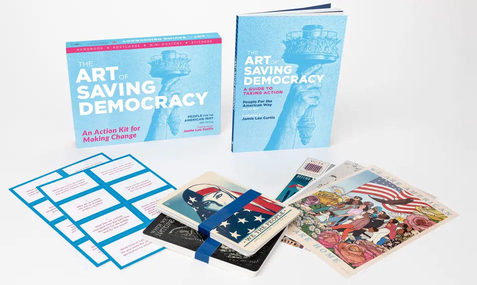 A collection of items from the Art of Saving Democracy, including book, stickers and posters