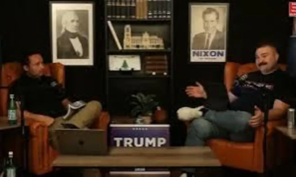 Andrew Iske and C. Jay Engle seated in armchairs, hosting a podcast