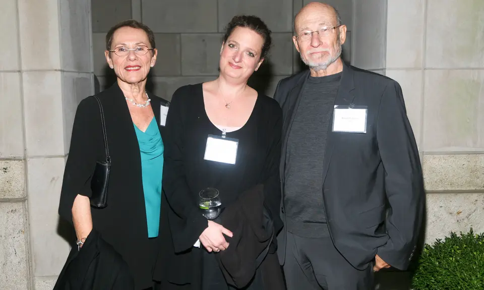 Three people posing: Left Frayda Feldman, middle unknown, right Ronald Feldman. 