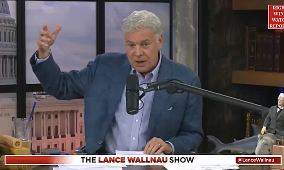 Lance Wallnau in his studio with image of US Capitol projected behind him