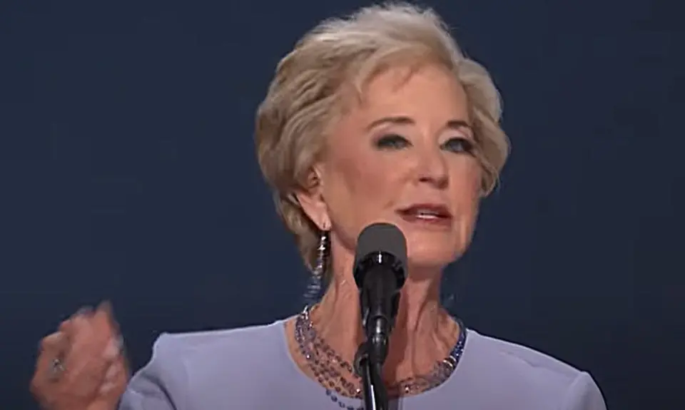 Image of Linda McMahon gesturing with her right hand while speaking into microphone on stage at the 2024 Republican National Convention