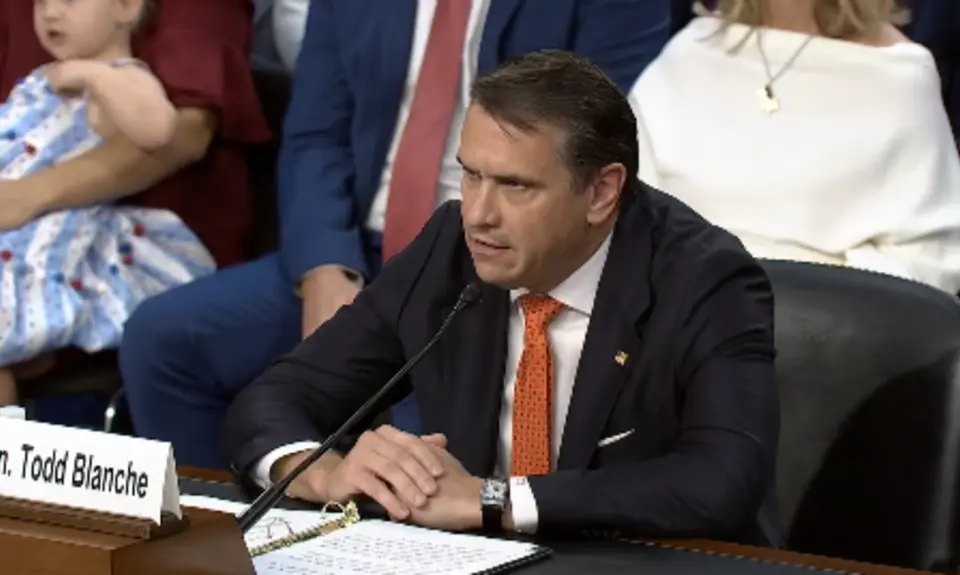 Todd Blanche wears a black suit and testifies before the Senate Committee on the Judiciary