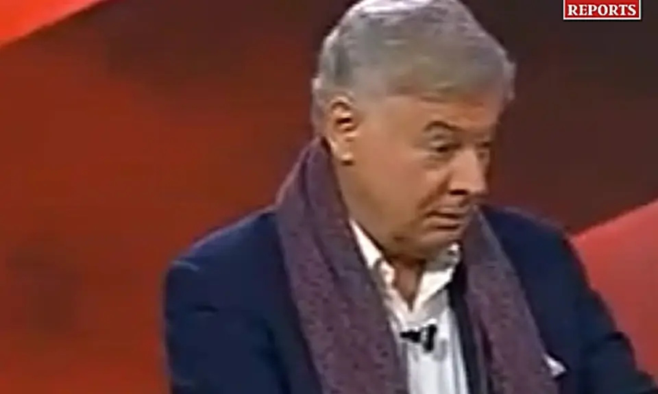 Lance Wallnau on set of Flashpoint wearing blue blazer with a purple scarf around his neck