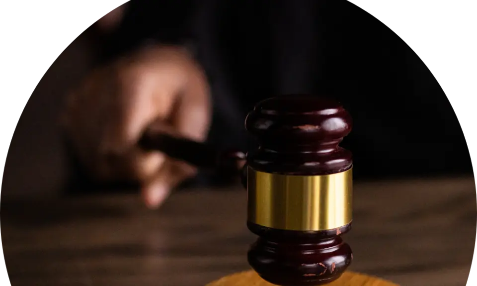 image of hand striking down a gavel
