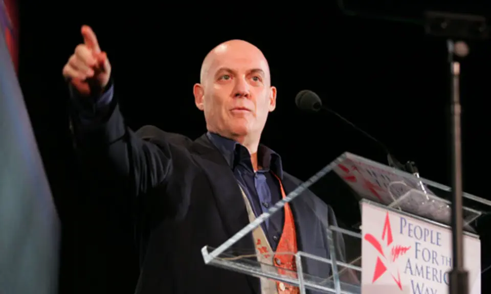 Howie Klein standing behind a podium 