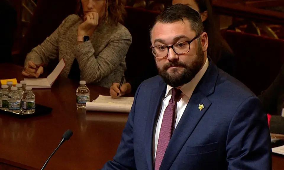 Benjamin Flowers wearing a dark suit