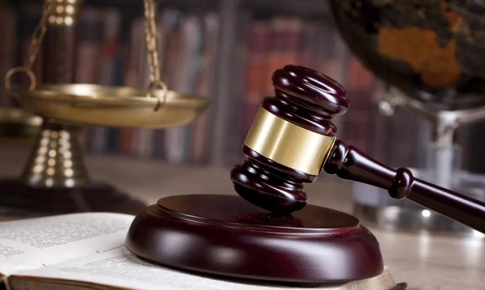 A gavel sitting on a table.
