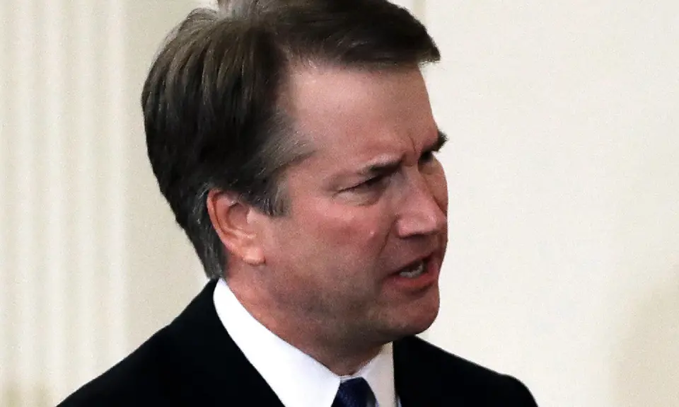 A closeup of Brett Kavanaugh furrowing his brow