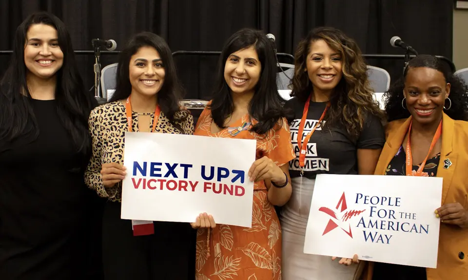 Lizet Ocampo, Sammi Brown, Eloria Diaz, Anna Eskamani, and Summer Lee hold PFAW signs at the 2019 Netroots Nation conference