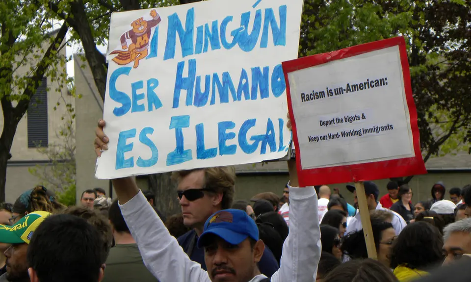 Activists hold signs protests racism