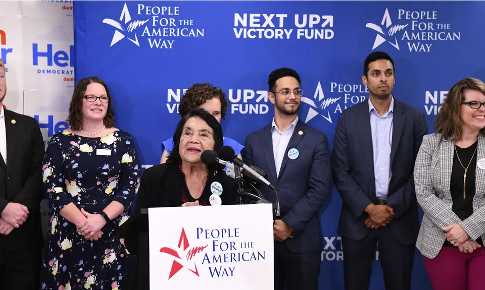 Dolores Huerta at the speaker's podium at PFAW's Next Up 2019 Virginia kickoff event.