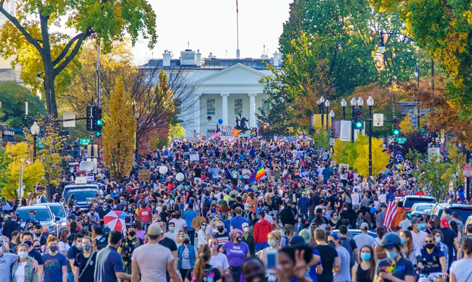 Washington, DC residents celebrate the election of Joe Biden and Kamala Harris in front of the White House.