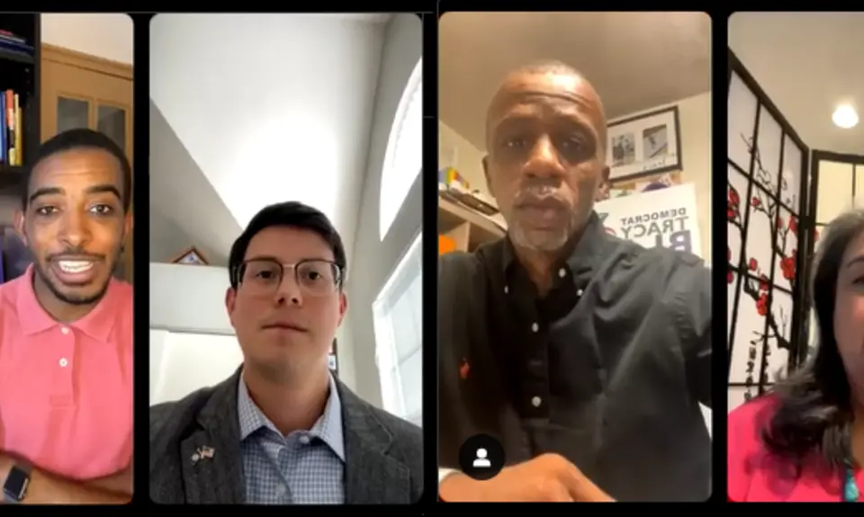 A screen shot of a video discussion between four individuals.