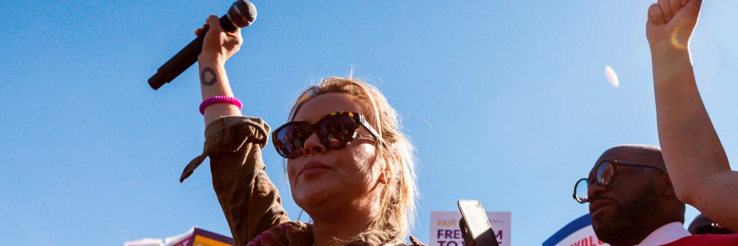 Activist with hand raised.