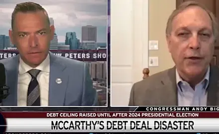 Image is taken from video of the Stew Peters show. It is a split-screen image with host Stew Peters on the left and Rep. Andy Biggs on the right. Text below them reads "McCarthy's Debt Deal Disaster."