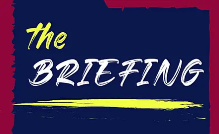 Logo for The Briefing feature: text on file folder-shaped background
