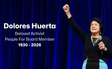 An image of Dolores Huerta raising her fist in front of a blue background with text reading "Dolores Huerta, Beloved Activist, People For Board Member, 1930 - 2026"