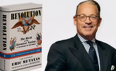 The left side of the image is a photograph of Eric Metaxas' book "Revolution." The ride side is a chest-and-head portrait of Metaxas in suit and tie smiling for the camera. 