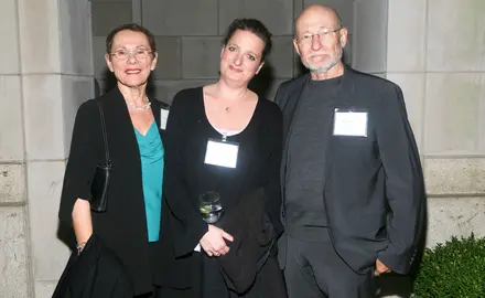 Three people posing: Left Frayda Feldman, middle unknown, right Ronald Feldman. 