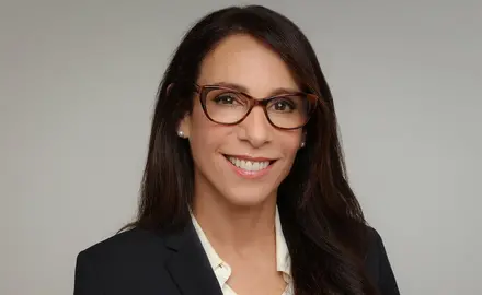 Portrait photo of Katherine Stewart smiling into the camera