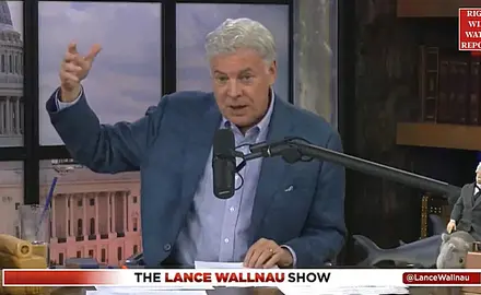 Lance Wallnau in his studio with image of US Capitol projected behind him
