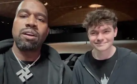 Nick Fuentes With Kanye West, who is wearing a large swastika necklace