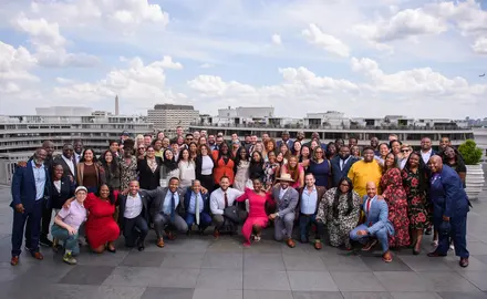 A group of Young Elected Officials posing on the roof of a building.