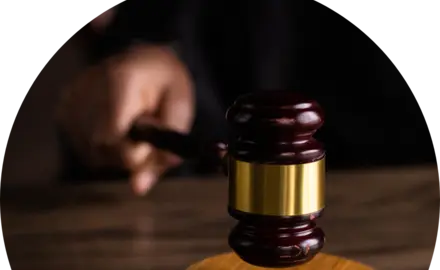 image of hand striking down a gavel