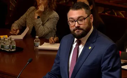 Benjamin Flowers wearing a dark suit