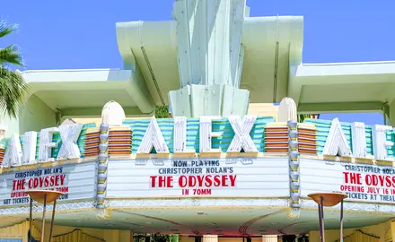 The marque of a movie theater called the Alex Theater showing Christopher Nolan's The Odyssey. 
