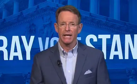 FRC President Tony Perkins faces camera while standing in front of logo of Pray Vote Stand, FRC's annual religious-right activist conference.