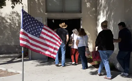 Voters waiting in line at polling place