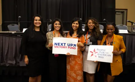 Lizet Ocampo, Sammi Brown, Eloria Diaz, Anna Eskamani, and Summer Lee hold PFAW signs at the 2019 Netroots Nation conference