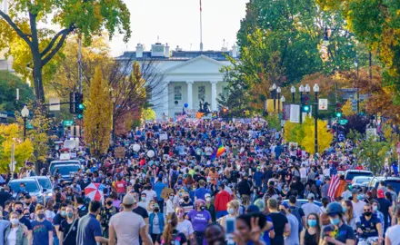 Washington, DC residents celebrate the election of Joe Biden and Kamala Harris in front of the White House.