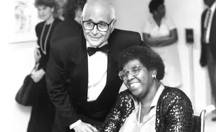 Norman Lear stands next to Barbara Jordan.