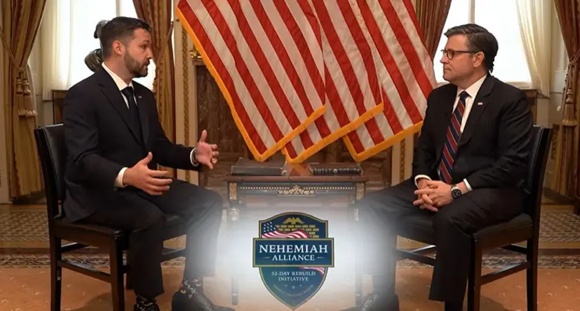 House Speaker Mike Johnson and Pastor Tyler Feller are seated and facing each other in front of several American flags; the shield-shaped logo of the Nehemiah Alliance is superimposed on the screen in the foreground