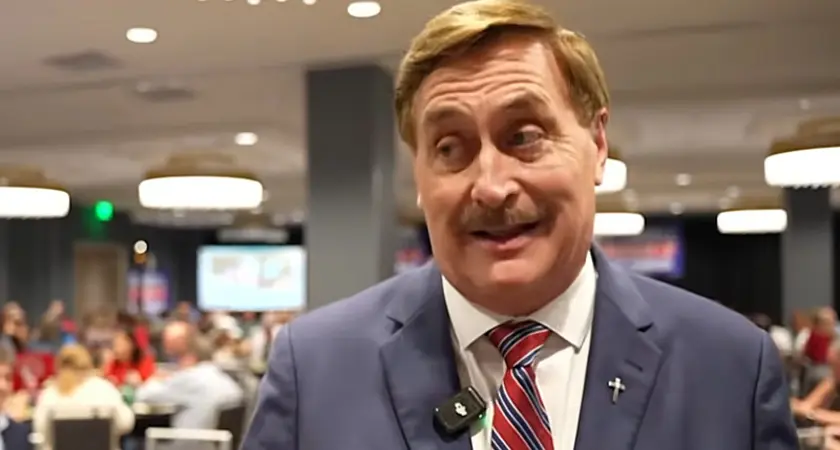 Mike Lindell, in suit and tie, is speaking to a reporter from his Aug. 11, 2026 election watch party.