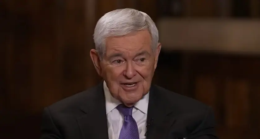 Newt Gingrich, an older white man with gray hair and wearing suit and tie, is speaking while looking toward Sean Hannity who is off camera at this moment.