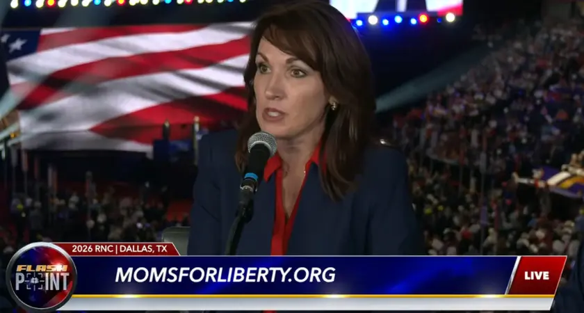 Tina Descovich is seated with a crowd shot of the RNC midterm convention behind her. Beneath her image is chyron with the logo for FlashPoint and text momsforliberty.org.