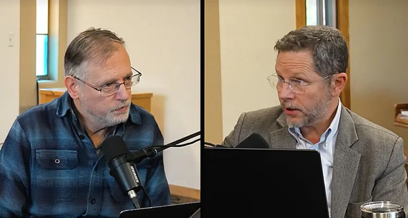 Split screen shows Kevin Swanson on the left, Raymond Simmons on the right, both seated in what appear to be modern church buildings. Swanson is speaking into a microphone and Simmonds has a laptop open in front of him. 