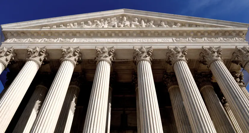 An image of the facade of the Supreme Court Building taken from below.