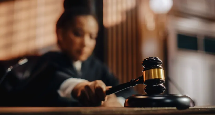 A stock photo of a judge slamming down a gavel.