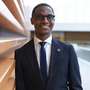 Justin Bibb wearing a dark blue suit