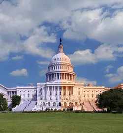 A picture of the Capitol building shaded blue on the left and red on the right.