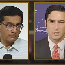 Split-screen image from Dinesh D'Souza's podcast, with D'Souza on the left listening and Rep. Brandon Gill, his son-in-law, on the right speaking.