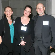 Three people posing: Left Frayda Feldman, middle unknown, right Ronald Feldman. 