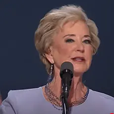 Image of Linda McMahon gesturing with her right hand while speaking into microphone on stage at the 2024 Republican National Convention