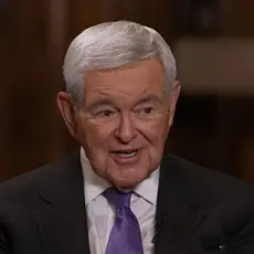 Newt Gingrich, an older white man with gray hair and wearing suit and tie, is speaking while looking toward Sean Hannity who is off camera at this moment.