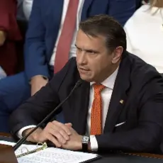 Todd Blanche wears a black suit and testifies before the Senate Committee on the Judiciary